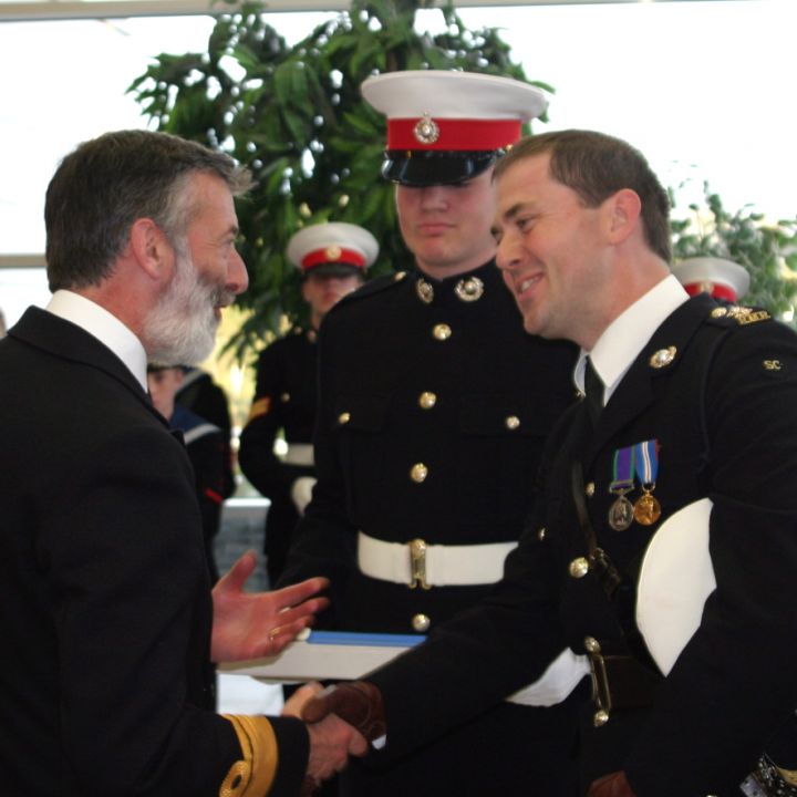 PRESENTATION OF ILLUMINATED ADDRESS BY...