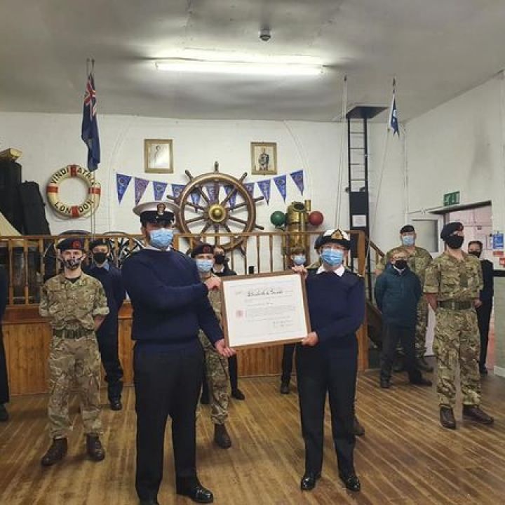 Lt. Gill presented with Commissioning Scroll