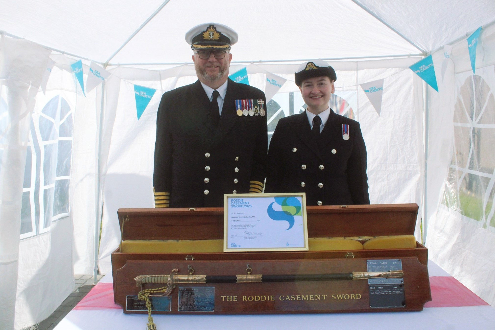 Captain Sea Cadets presents Lt. Daly with sword