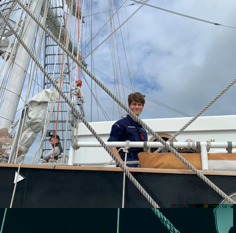 Cadet standing on board the off-shore sailing ship TS Royalist