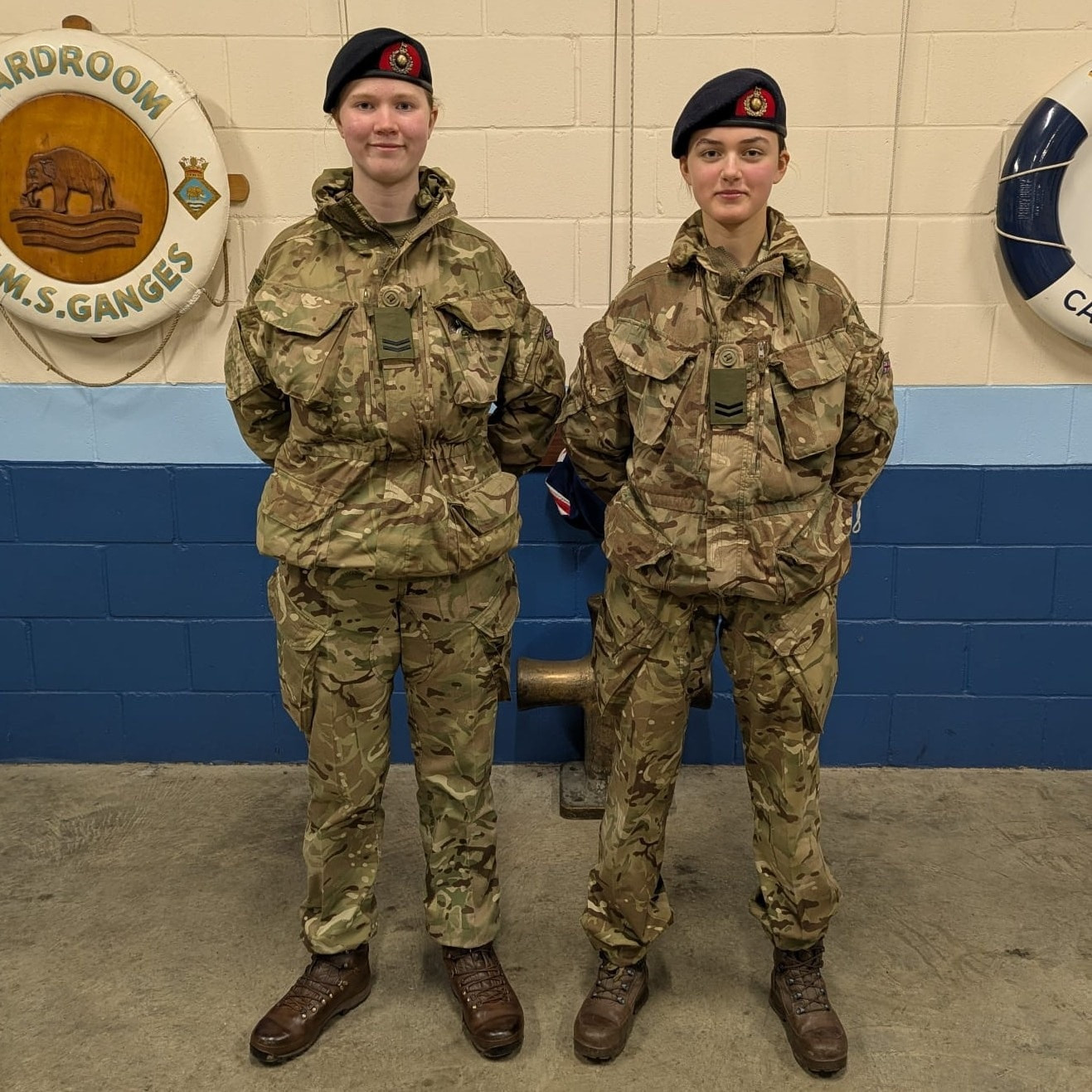 Corporals Champion and Kujawska wearing their new rate slides.