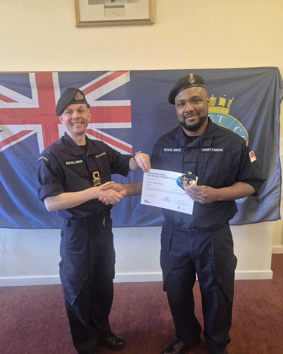 Image showing staff member receiving their promotion.